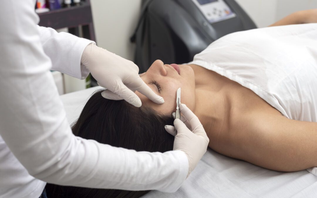 A woman getting a facial peel from a doctor